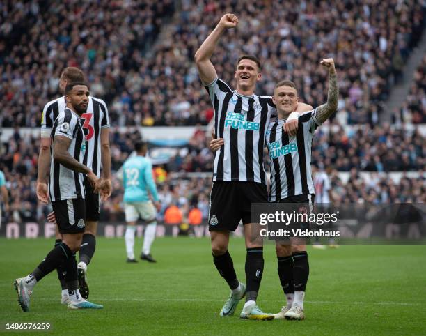 Kieran Trippier and Sven Botman of Newcastle United celebrate their team's third goal with team mates Callum Wilson and Dan Burn during the Premier...