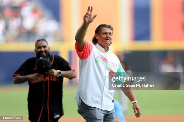 Retired MLB pitcher Trevor Hoffman waves after throwing out the ceremonial first pitch prior to the MLB World Tour Mexico City Series between the San...