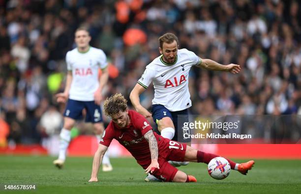 Harvey Elliott of Liverpool is tackled by Harry Kane of Tottenham Hotspur during the Premier League match between Liverpool FC and Tottenham Hotspur...