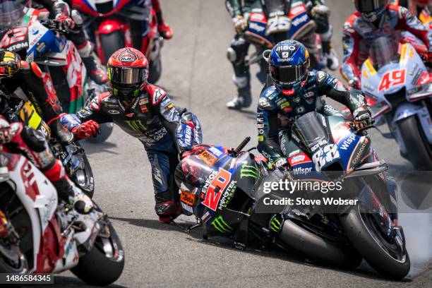 Miguel Oliveira of Portugal and CryptoDATA RNF MotoGP Team crashes with Fabio Quartararo of France and Monster Energy Yamaha MotoGP during the race...
