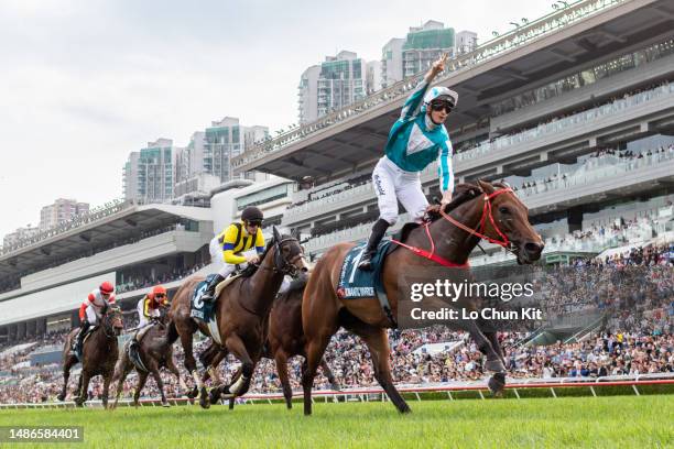 Jockey James McDonald riding Romantic Warrior wins the Race 8 FWD Queen Elizabeth II Cup at Sha Tin Racecourse on April 30, 2023 in Hong Kong.
