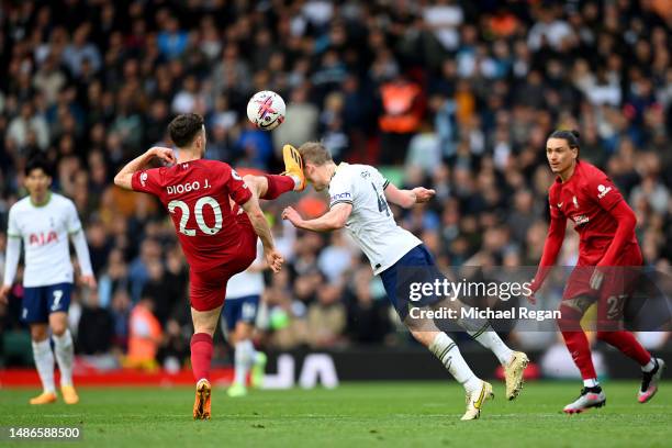 Diogo Jota of Liverpool clashes with Oliver Skipp of Tottenham Hotspur causing an injury during the Premier League match between Liverpool FC and...