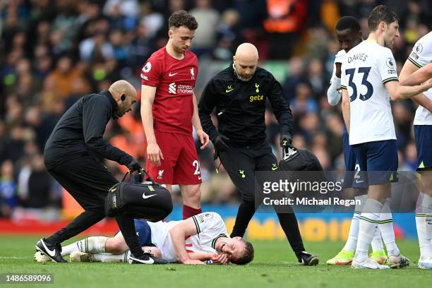 Oliver Skipp of Tottenham Hotspur receives medical treatment during the Premier League match between Liverpool FC and Tottenham Hotspur at Anfield on...