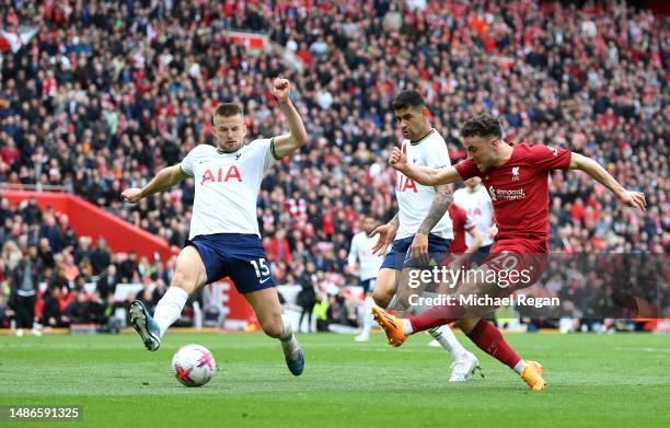 Diogo Jota of Liverpool scores the team's fourth goal whilst under pressure from Eric Dier of Tottenham Hotspur during the Premier League match...