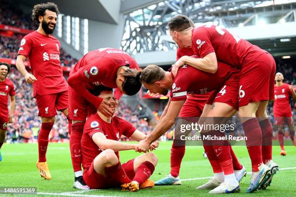 Diogo Jota of Liverpool celebrates with teammates after scoring the team's fourth goal during the Premier League match between Liverpool FC and...