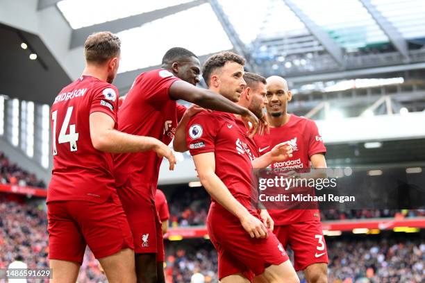 Diogo Jota of Liverpool celebrates with teammates after scoring the team's fourth goal during the Premier League match between Liverpool FC and...