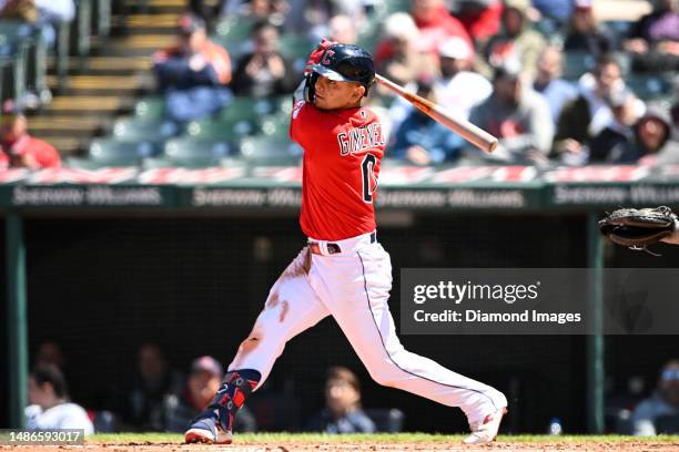 Andrés Giménez of the Cleveland Guardians hits a double during fourth inning against the Colorado Rockies at Progressive Field on April 26, 2023 in...