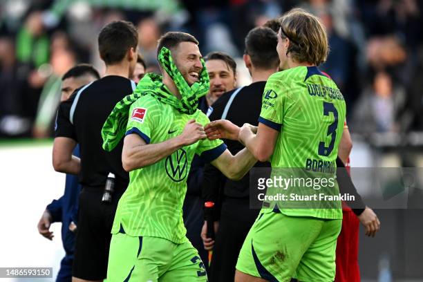 Mattias Svanberg and Sebastiaan Bornauw of VfL Wolfsburg celebrate after the team's victory in the Bundesliga match between VfL Wolfsburg and 1. FSV...