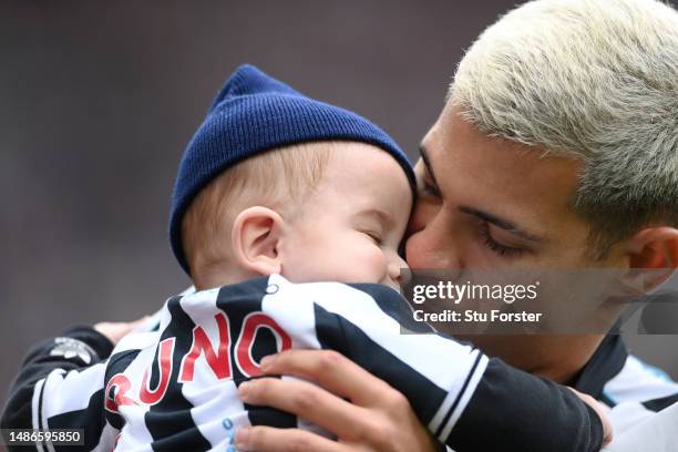 Newcastle player Bruno Guimaraes pictured with his child before the Premier League match between Newcastle United and Southampton FC at St. James...