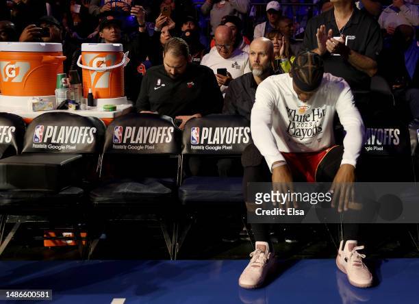 Jimmy Butler of the Miami Heat sits in the bench during player introductions before game one of the Eastern Conference Semifinals against the New...