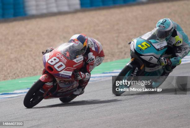 David Alonso of Colombia and GasGas Aspar Team leads Jaime Masia of Spain and Leopard Racing during the Moto3 race during the MotoGP Of Spain - Race...