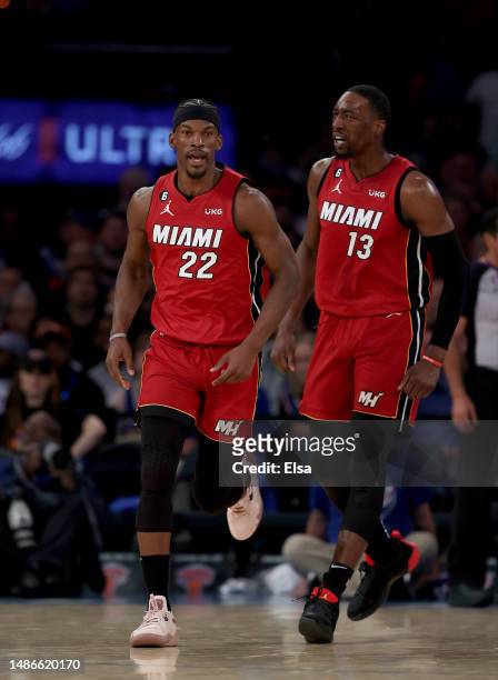 Jimmy Butler and Bam Adebayo of the Miami Heat celebrate in the second half of game one of the Eastern Conference Semifinals against the New York...