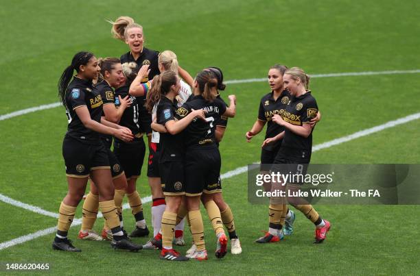 Courtney Sweetman-Kirk of Sheffield United celebrates with teammates after scoring the team's first goal while Rosanna Parnell of Southampton FC...