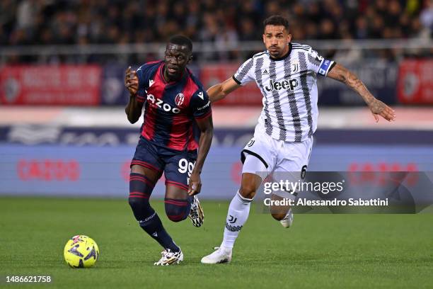 Musa Barrow of Bologna FC battles for possession with Danilo of Juventus during the Serie A match between Bologna FC and Juventus at Stadio Renato...