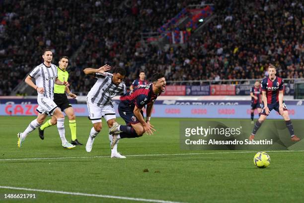 Riccardo Orsolini of Bologna FC is fouled by Danilo of Juventus leading a penalty being awarded during the Serie A match between Bologna FC and...