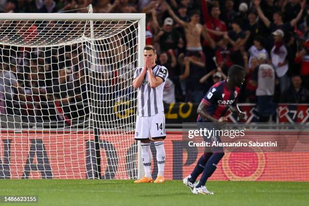 Arkadiusz Milik of Juventus reacts after having a penalty kick saved by Lukasz Skorupski of Bologna FC during the Serie A match between Bologna FC...