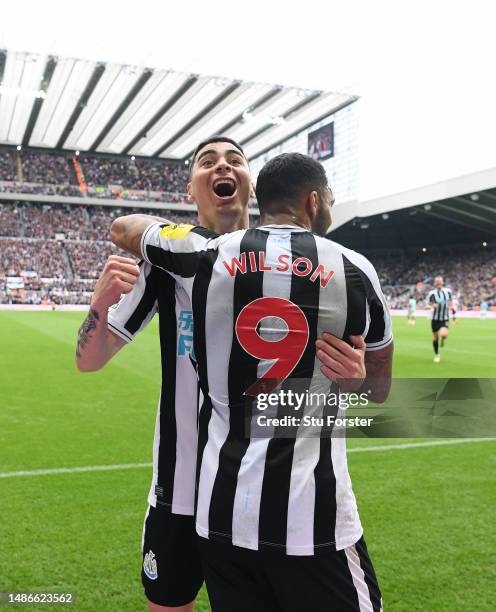 Newcastle striker Callum Wilson celebrates with Miguel Almiron after scoring the third goal during the Premier League match between Newcastle United...