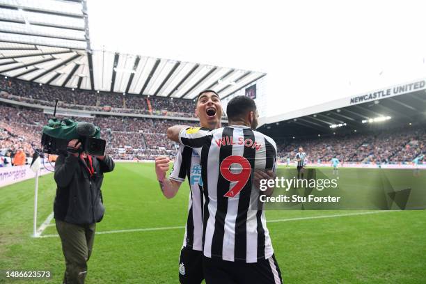 Newcastle striker Callum Wilson celebrates with Miguel Almiron after scoring the third goal during the Premier League match between Newcastle United...