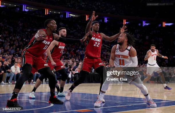 Jalen Brunson of the New York Knicks heads for the net as Bam Adebayo,Max Strus and Jimmy Butler of the Miami Heat defend during game one of the...