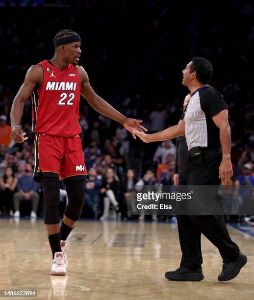 Jimmy Butler of the Miami Heat discusses a call with the referee in the second half against the New York Knicks during game one of the Eastern...