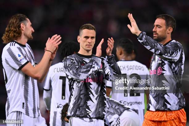 Arkadiusz Milik of Juventus applauds the fans after the Serie A match between Bologna FC and Juventus at Stadio Renato Dall'Ara on April 30, 2023 in...