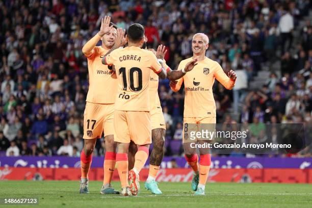Antoine Griezmann of Atletico Madrid celebrates their side's fourth goal, an own goal by Joaquin of Real Valladolid CF with Saul Niguez and Angel...