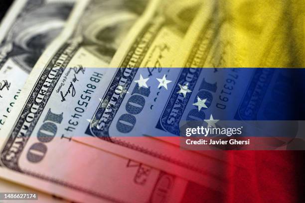 cash dollar banknotes and flag of venezuela - venezuela stock pictures, royalty-free photos & images