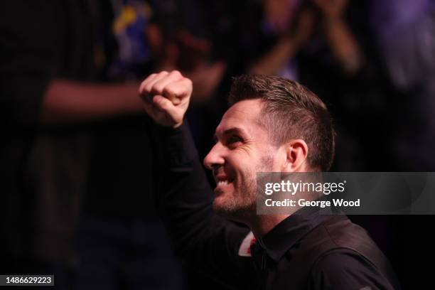 Mark Selby of England celebrates making a maximum 147 break during their Final match against Luca Brecel of Belgium on Day Sixteen of the Cazoo World...