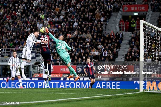 Dusan Vlahovic of Juventus hits the ball but Lukasz Skorupski goalkeeper of Bologna FC saves during the Serie A match between Bologna FC and Juventus...