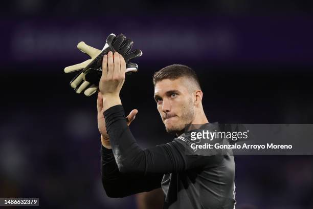 Goalkeeper Ivo Grbic of Atletico de Madrid acknowledges the audience after winning the LaLiga Santander match between Real Valladolid CF and Atletico...