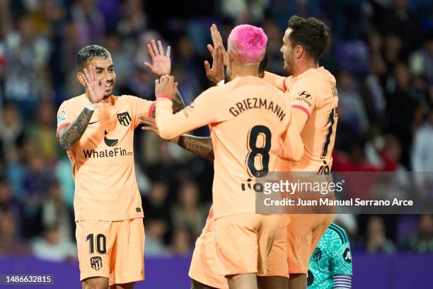 Angel Correa of Atletico Madrid celebrates their side's fourth goal, an own goal by Joaquin of Real Valladolid CF with Saul Niguez and Antoine...