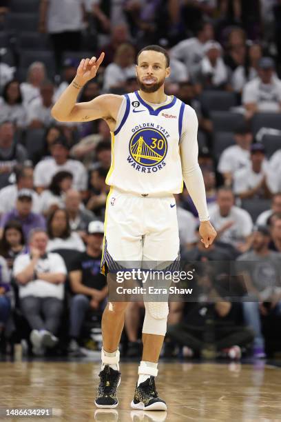 Stephen Curry of the Golden State Warriors gestures during the third quarter in game seven of the Western Conference First Round Playoffs against the...