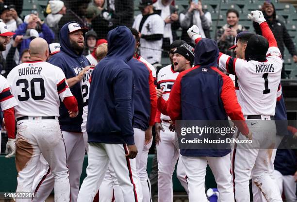 Andrew Vaughn of the Chicago White Sox is mobbed by teammates following a three run home run during the ninth inning of a game against the Tampa Bay...