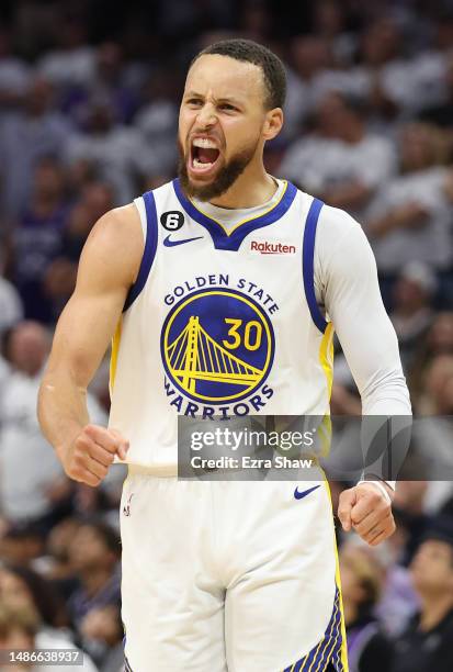 Stephen Curry of the Golden State Warriors celebrates during the third quarter in game seven of the Western Conference First Round Playoffs against...
