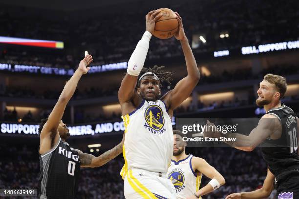 Kevon Looney of the Golden State Warriors handles the ball during the third quarter in game seven of the Western Conference First Round Playoffs...