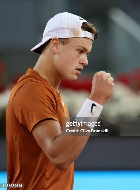 Holger Rune of Denmark celebrates a point against Alejandro Davidovich Fokina of Spain during their third round match on day seven of the Mutua...