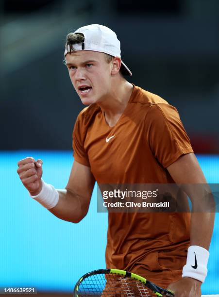 Holger Rune of Denmark celebrates a point against Alejandro Davidovich Fokina of Spain during their third round match on day seven of the Mutua...