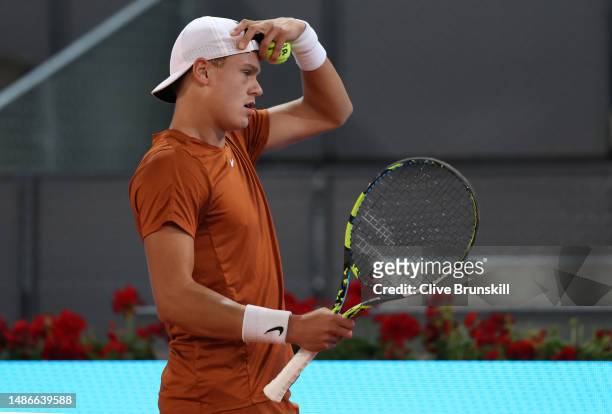 Holger Rune of Denmark shows his dejection against Alejandro Davidovich Fokina of Spain during their third round match on day seven of the Mutua...