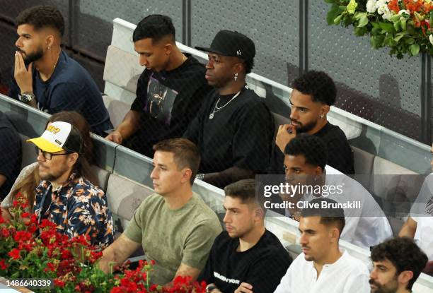 Vinicius Junior of Real Madrid watches on as Carlos Alcarez of Spain plays against Grigor Dimitrov of Bulgaria during the men's third round match on...