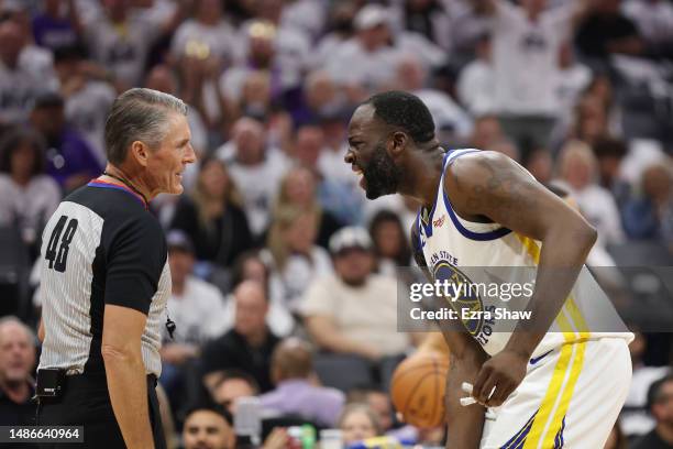 Draymond Green of the Golden State Warriors talks to referee Scott Foster during the second quarter in game seven of the Western Conference First...