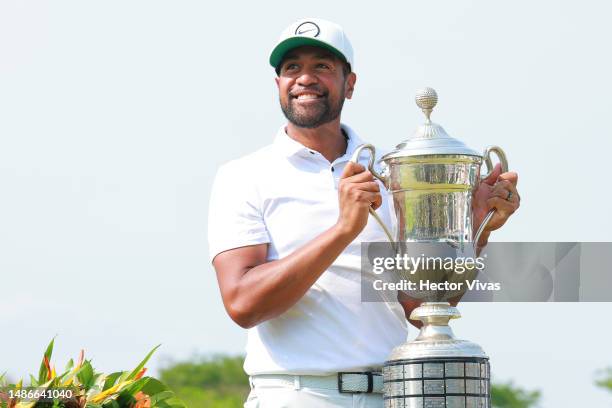 Tony Finau of the United States holds the Mexico Open at Vidanta champions trophy during the award ceremony of the Mexico Open at Vidanta on April...