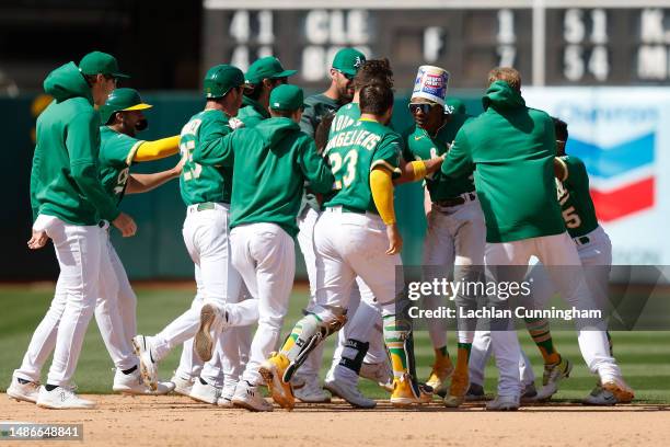 Esteury Ruiz of the Oakland Athletics celebrates after hitting a walk-off single in the bottom of the ninth inning against the Cincinnati Reds at...