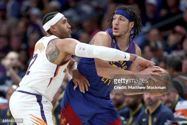 Aaron Gordon of the Denver Nuggets is guarded by Ish Wainright of the Phoenix Suns in the fourth quarter at Ball Arena on April 29, 2023 in Denver,...