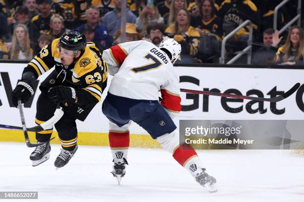 Radko Gudas of the Florida Panthers hits Brad Marchand of the Boston Bruins during the first period in Game Seven of the First Round of the 2023...