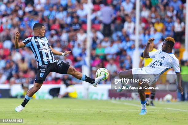 Jonathan Perlaza of Queretaro fights for the ball with Aviles Hurtado of Pachuca during the 17th round match between Querétaro and Pachuca as part of...