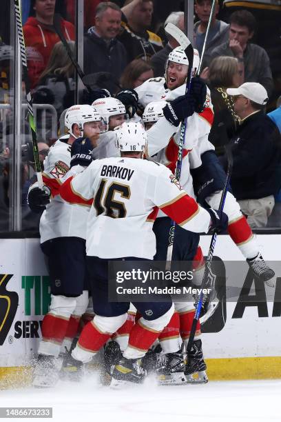 Brandon Montour of the Florida Panthers celebrates with Aleksander Barkov, Carter Verhaeghe, Sam Reinhart, and Sam Bennett after scoring a goal...