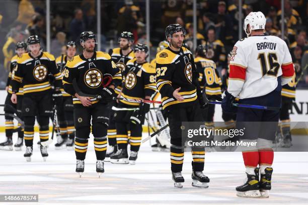 Patrice Bergeron of the Boston Bruins shakes hands with Aleksander Barkov of the Florida Panthers after the Panthers defeat the Bruins 4-3 in...