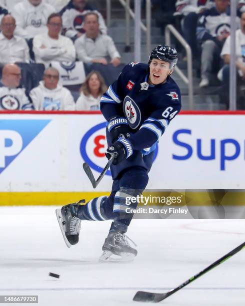 Logan Stanley of the Winnipeg Jets takes a shot on goal during first period action against the Vegas Golden Knights in Game Four of the First Round...