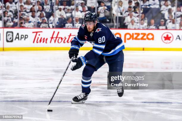 Pierre-Luc Dubois of the Winnipeg Jets plays the puck down the ice during second period action against the Vegas Golden Knights in Game Four of the...