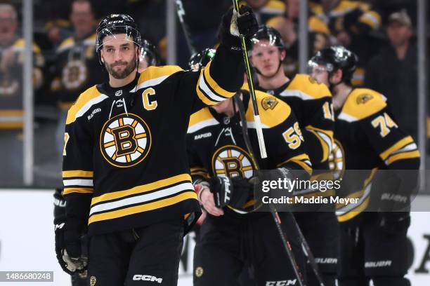 Patrice Bergeron of the Boston Bruins waves to fans before exiting the ice after Florida Panthers defeat the Bruins 4-3 in overtime of Game Seven of...